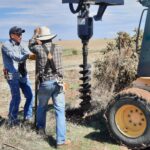 Local ranch employees were hired to help start construct ion of fence.