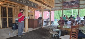 Presenter giving an extension presentation to onion growers