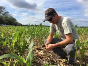 Jason Carter inspects the soil. 