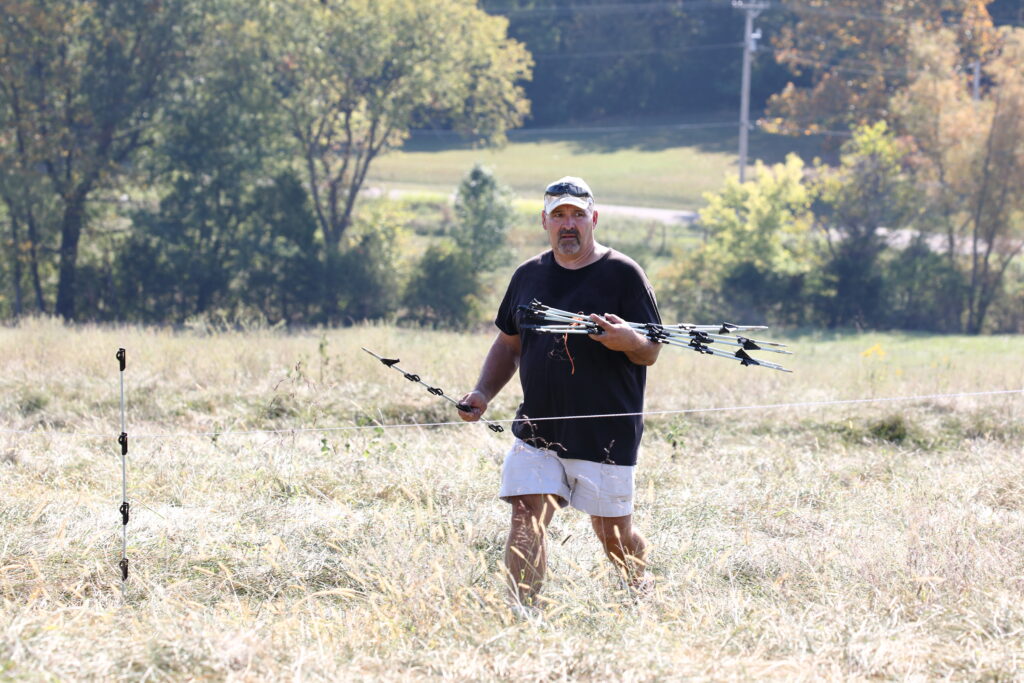 Setting up step in posts in a pasture