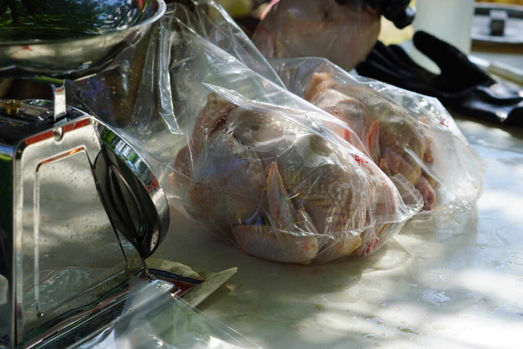 Packaged chickens with a scale on the side