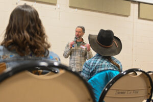 Reunity Resources Compost Operations Manager Trevor Ortiz presenting at presenting at NMCEWL to area ranchers and farmers
