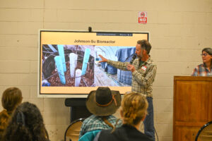 Reunity Resources Compost Operations Manager Trevor Ortiz presenting at presenting at NMCEWL to area ranchers and farmers