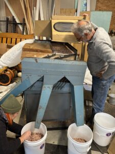 Blue piece of equipment and people