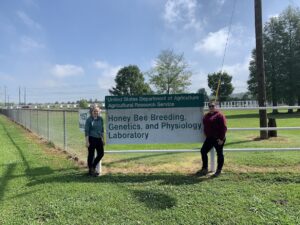 people standing near a sign outdoors