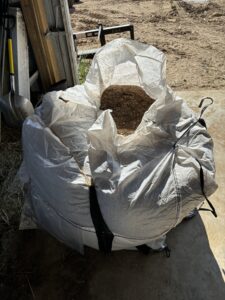 shredded leaves in white bags