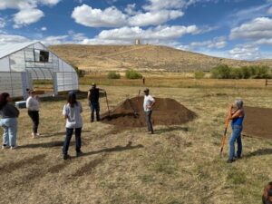 Compost and workshop participants at WRFSP listening to Jonah talk about the technique