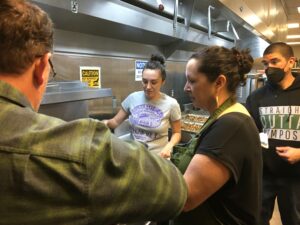Indigenous guest chef leads a cooking demonstration