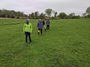 IL R&D Farm Interns flagging a fence in pasture