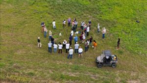 Aerial photo of soil health field day participants in a field