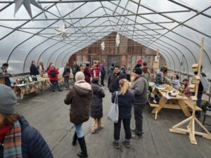 People looking at exhibits in a greenhouse
