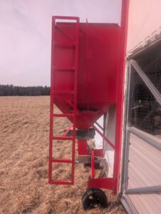 View of bin with ladder, attached to coop
