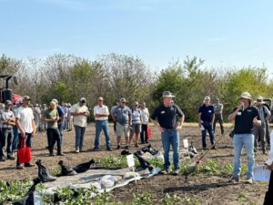 Josue Cerritos (right, with mic), a graduate researcher in Dr. Steve Meyers’ Horticulture Crops Weed Science Lab, discusses the timing of silage tarp application for weed control during the morning education sessions. Photo provided by the Meyers Lab.
