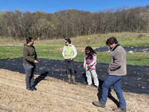 Fig. Temperature sensor installation at Farm B and C with the farmers.