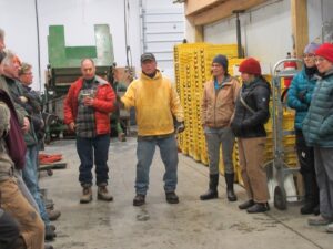 Pooh describing the crop harvesting and washing procedures they use on the farm during the farm tour.