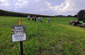 Sign and Farmers at Field Day