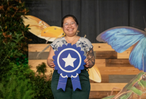 Lead Investigator Justine winning the first place prize for her talk on this research!