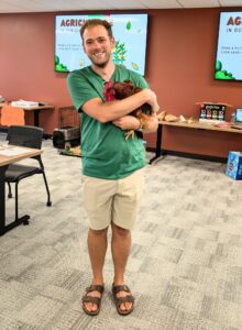 Master Gardener Cody Long from Two Guys LLC brought in a chicken and rooster for Jr Green Thumb demonstration.