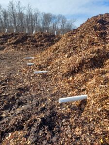 Static Aerated Pile ready for the blower fan to be installed, the vertical pipe pile in the background.