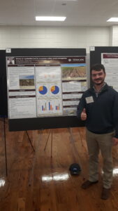 M.S. student Matthew Stewart presenting his sheep weeding research poster at the 2023 Texas Plant Protection Conference.