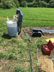 Arthur Davis prepares urine fertilization system for hemp crop