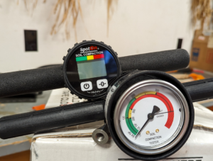 The gauges of a digital and an analog penetrometer are shown side by side. 