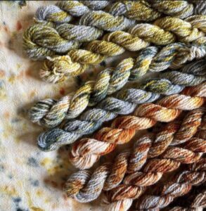Naturally dyed skeins of yarn