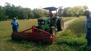 tractor with roller crimper attachment