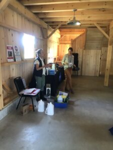 Drs. Walsh and Hurwitz, Maine state and assistant state veterinarians, discussing use of biosecurity supplies