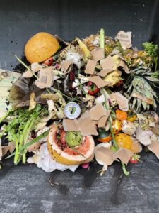 pile of food waste with a thermometer sticking out
