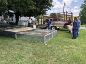 Hermann Weber shows  field day participants the basics of building a reliable, cost-effective chicken tractor,