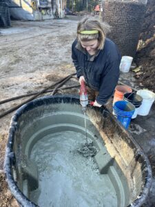 Mixing local clay slurry