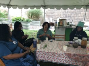 Rosana Marroquin workshop on herbalism using herbs from the garden.