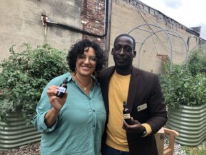 Roxana Marroquin and Tobias Fox at their workshop on Ecopreneurship /  herbalism with herbs from the demonstration beds.