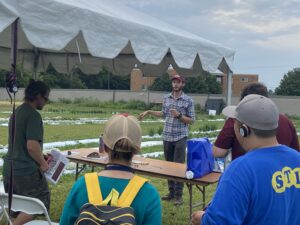 Matthew Gullickson, PhD student in the Rogers lab, talking about day neutral strawberry production at the 2023 Organic Fruit and Vegetable Field Day