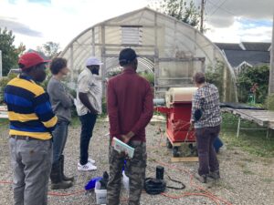 Farmers watching thresher demonstration