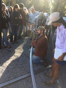 James Walawender show participants how to bend poles to make high tunnels 