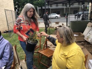 Michaeline Picaro teaches a workshop on Indigenous medicinal herbalism with a handson demonstration on making salves from herbs that will be planted in the raised beds.