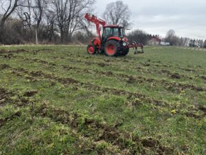 No-till. Tractor mounted subsoiler, for increased drainage prior to tarping. 