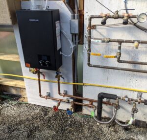 We installed an on-demand water heater to separate a heat storage and a back-up heat source. We anticipate the increased solar thermal energy collection. 