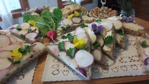 Photo of tea sandwiches made with colorful radish slices. 