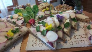 Photo of tea sandwiches made with colorful radish slices. 