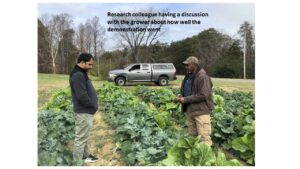 Farmer and researcher discuss  outcome of on-farm demonstration 