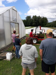 Farmers watch during soil steaming demonstration
