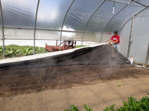 Bruce Wooster leads soil steaming demonstration in high tunnel