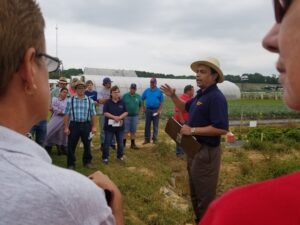 PI Dr. Rahman presents the results of the black root rot demonstration to the field day attendees