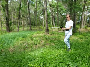 Taking light measurements in the hardwood area.