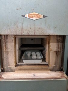 This image shows porcelain crucibles in a muffler furnace.