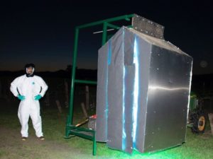UVC array in operation at night with operator in the proper PPE