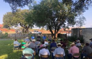 Attendees of the wool sheep field day participate in a discussion about genetic selection with cooperating ranchers.